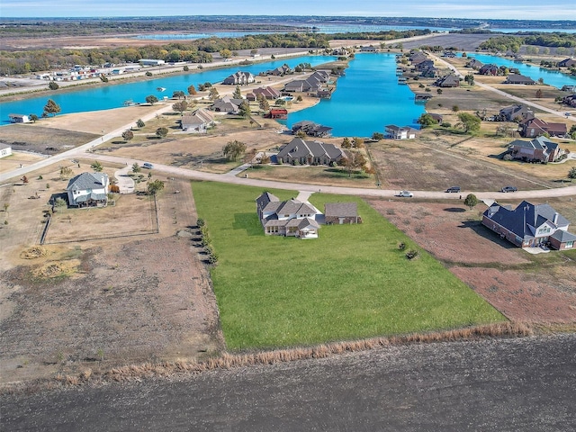 birds eye view of property with a residential view and a water view