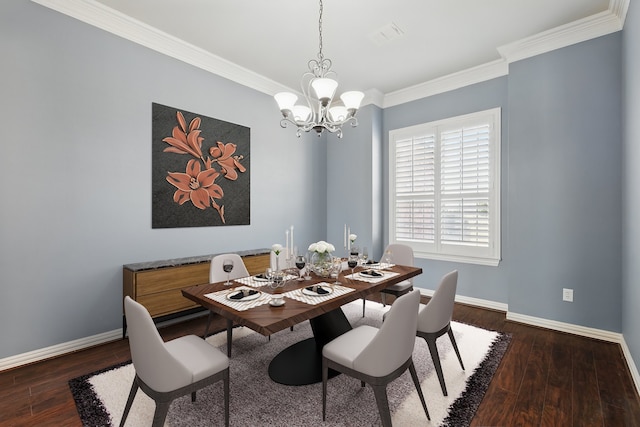 dining room with hardwood / wood-style floors, ornamental molding, baseboards, and a chandelier