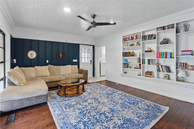 living area with wooden ceiling, wood finished floors, a ceiling fan, and ornamental molding