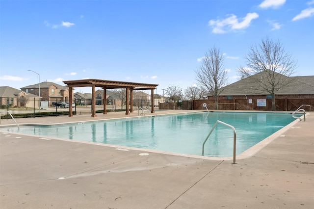 pool featuring a patio, fence, and a pergola