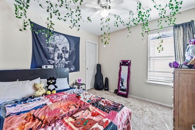 bedroom with carpet, baseboards, and ceiling fan