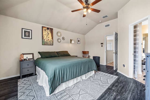 bedroom with lofted ceiling, wood finished floors, visible vents, and baseboards