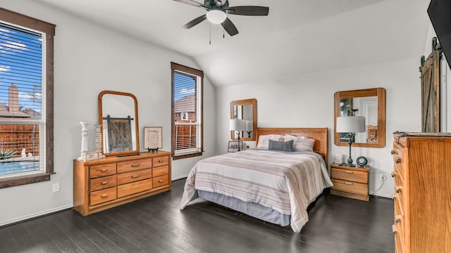 bedroom with dark wood-style floors, a ceiling fan, and lofted ceiling