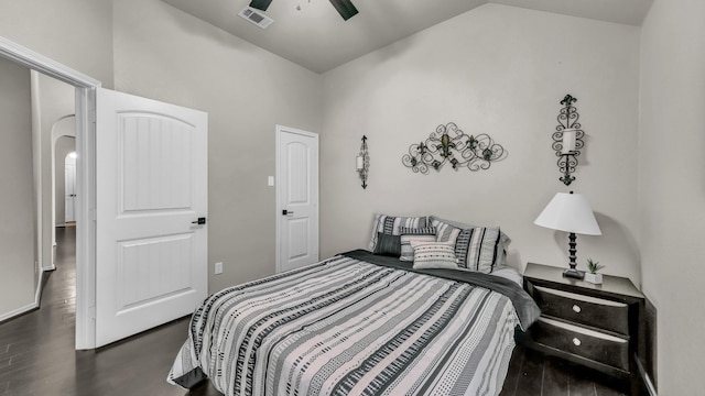 bedroom with visible vents, arched walkways, ceiling fan, and vaulted ceiling