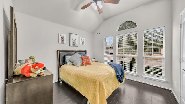 bedroom with lofted ceiling, a ceiling fan, dark wood-style flooring, and baseboards