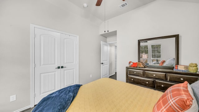 bedroom with visible vents, a closet, ceiling fan, and vaulted ceiling