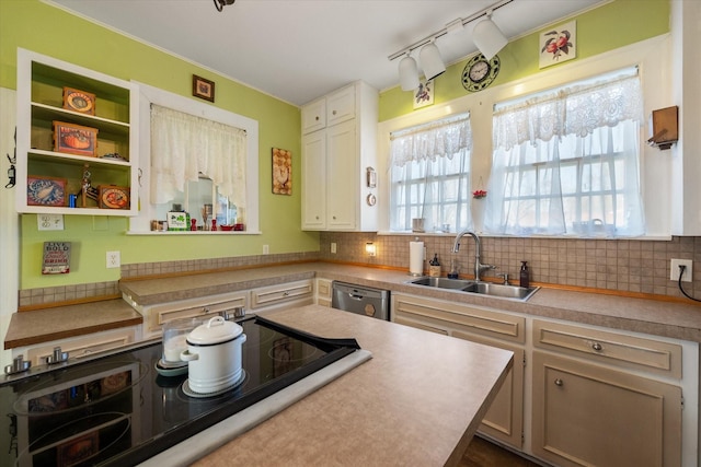 kitchen with black electric stovetop, a sink, tasteful backsplash, and dishwasher