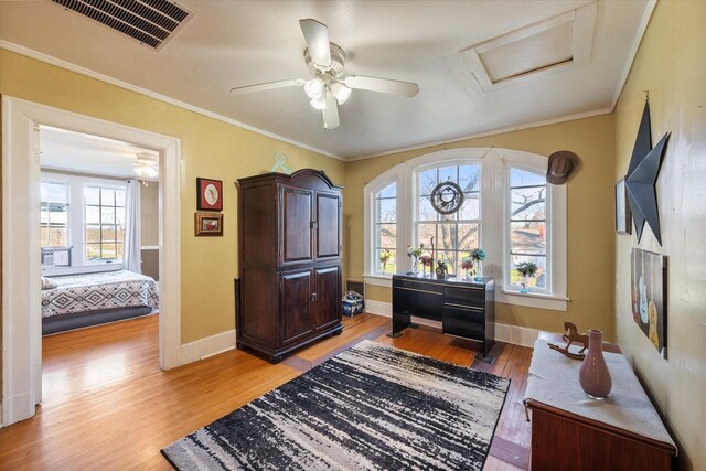 300 5th St, Kerens, TX 75144 - living area featuring light wood-style floors, baseboards, and crown molding