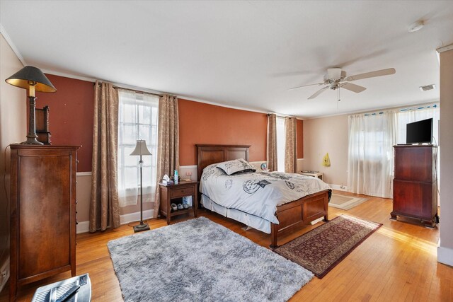 300 5th St, Kerens, TX 75144 - bedroom with ceiling fan, ornamental molding, wood finished floors, and a closet