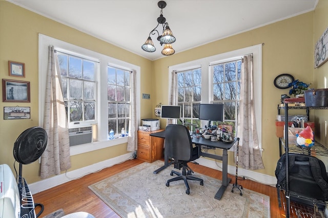 office featuring crown molding, baseboards, cooling unit, and wood finished floors