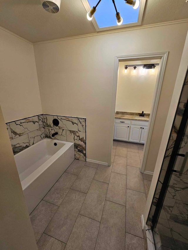 bathroom featuring visible vents, a stall shower, ornamental molding, a bath, and vanity