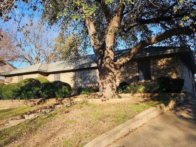 ranch-style home with brick siding