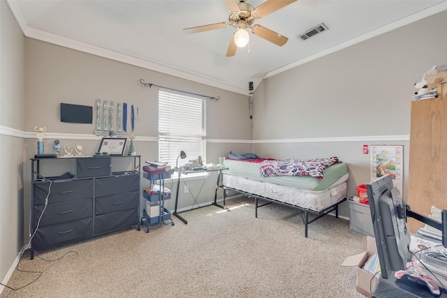 bedroom with visible vents, carpet flooring, crown molding, and ceiling fan