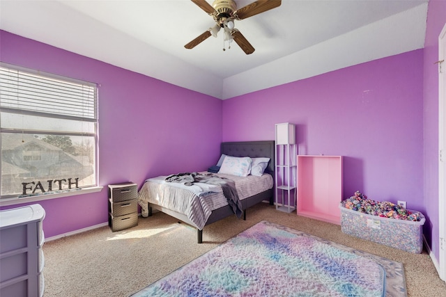 carpeted bedroom featuring a ceiling fan and baseboards