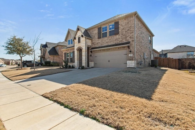 view of front of property with stone siding, cooling unit, concrete driveway, a garage, and brick siding