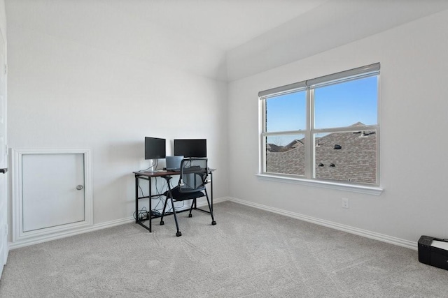 carpeted home office with baseboards