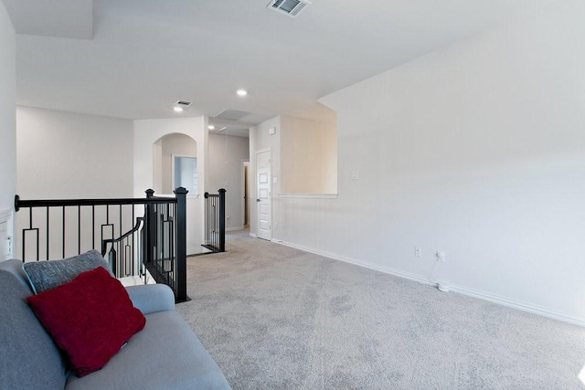 interior space featuring recessed lighting, baseboards, visible vents, and carpet floors