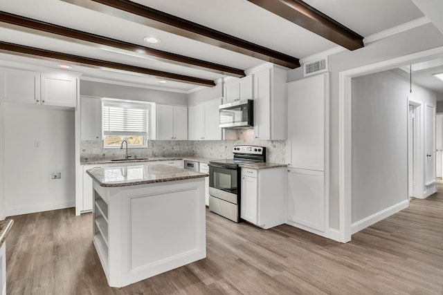 kitchen with stainless steel microwave, range with electric cooktop, visible vents, light wood-style flooring, and white cabinetry