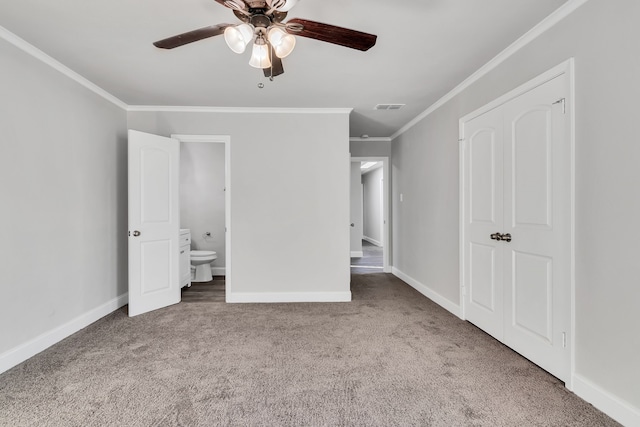 unfurnished bedroom with crown molding, carpet, visible vents, and baseboards