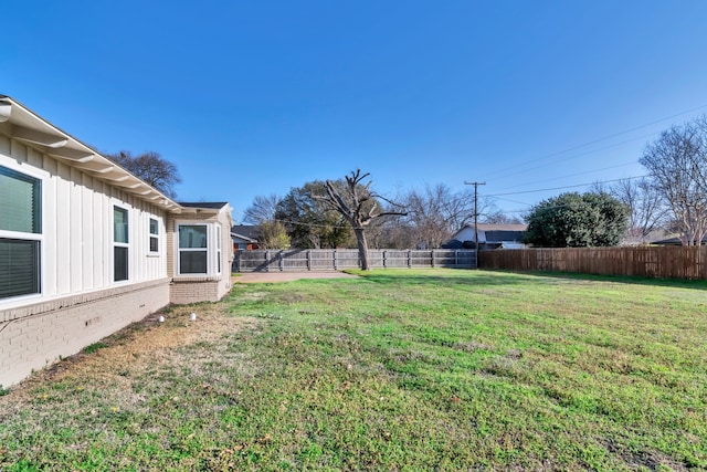 view of yard featuring a fenced backyard