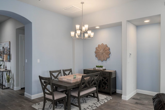 4152 Sanders Dr, Celina, TX 75009 - dining space with visible vents, arched walkways, baseboards, and dark wood-style floors