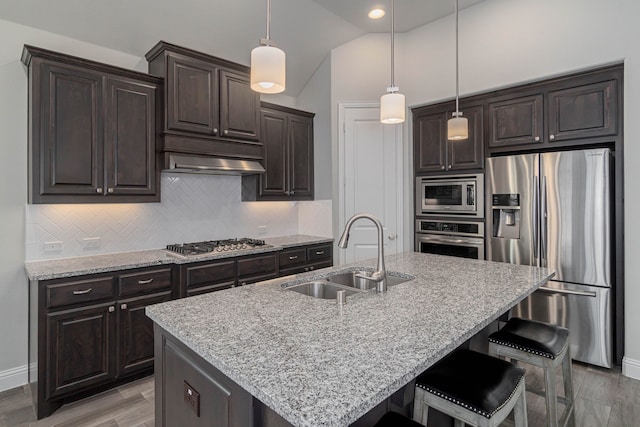 4152 Sanders Dr, Celina, TX 75009 - kitchen featuring dark brown cabinets, backsplash, appliances with stainless steel finishes, and a sink