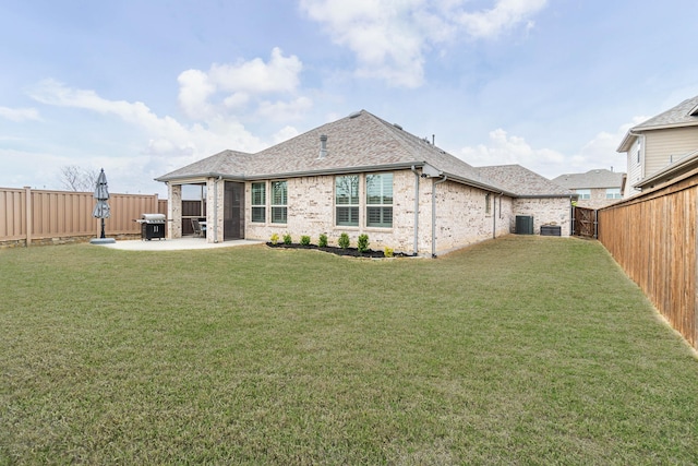 4152 Sanders Dr, Celina, TX 75009 - back of house featuring a yard, a patio area, brick siding, and a fenced backyard