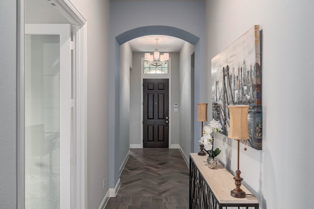 4152 Sanders Dr, Celina, TX 75009 - interior space with arched walkways, a chandelier, and baseboards