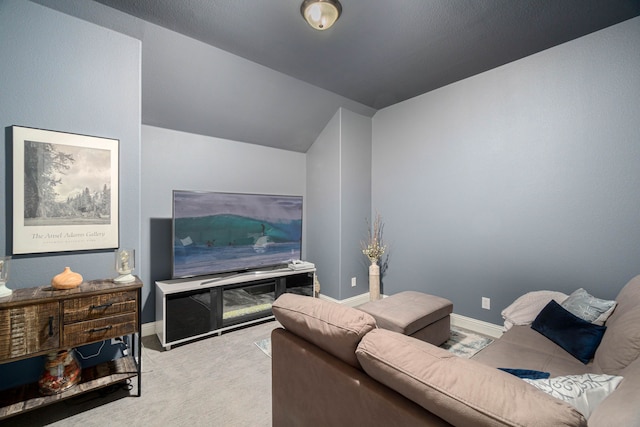 4152 Sanders Dr, Celina, TX 75009 - carpeted living area with lofted ceiling and baseboards