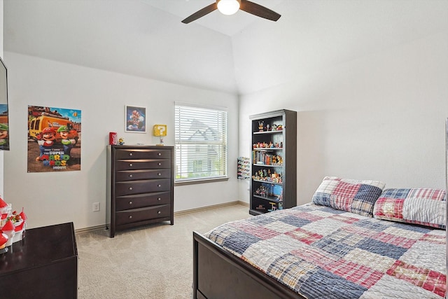 bedroom featuring baseboards, lofted ceiling, light colored carpet, and ceiling fan