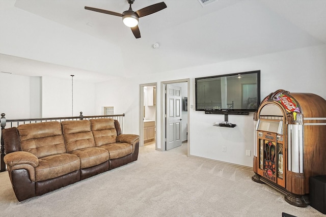 living room featuring vaulted ceiling, a ceiling fan, visible vents, and light carpet