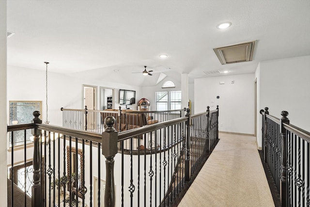 corridor with visible vents, an upstairs landing, recessed lighting, carpet, and attic access