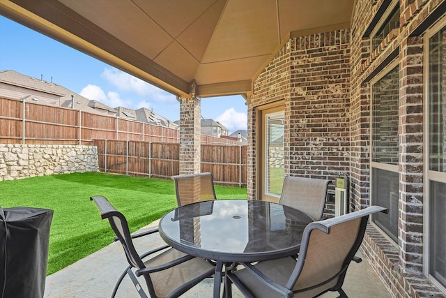 view of patio / terrace featuring outdoor dining space and a fenced backyard