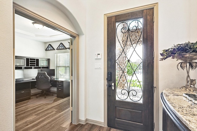 6015 Liverpool St, Celina, TX 76227 - foyer entrance with dark wood-style flooring, built in study area, and baseboards