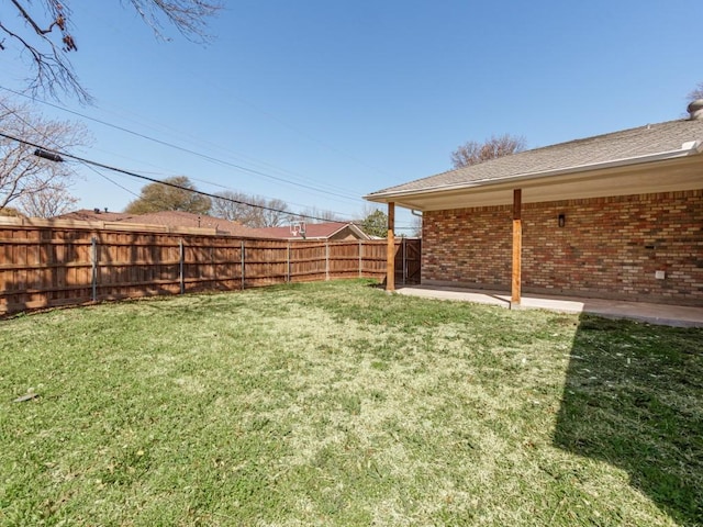 view of yard with a fenced backyard