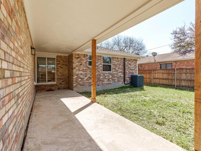 view of yard with a patio area, cooling unit, and fence