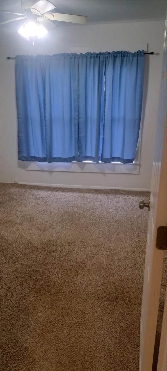 empty room with carpet flooring