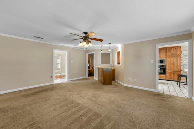 unfurnished living room featuring a ceiling fan, baseboards, visible vents, crown molding, and light colored carpet