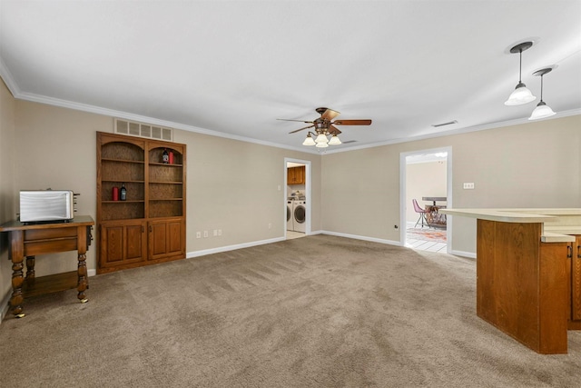 living room with visible vents, ceiling fan, ornamental molding, light carpet, and washer and dryer