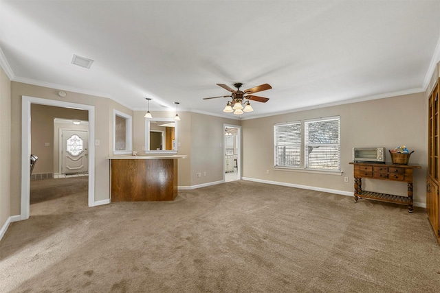 unfurnished living room with crown molding, baseboards, carpet floors, and ceiling fan