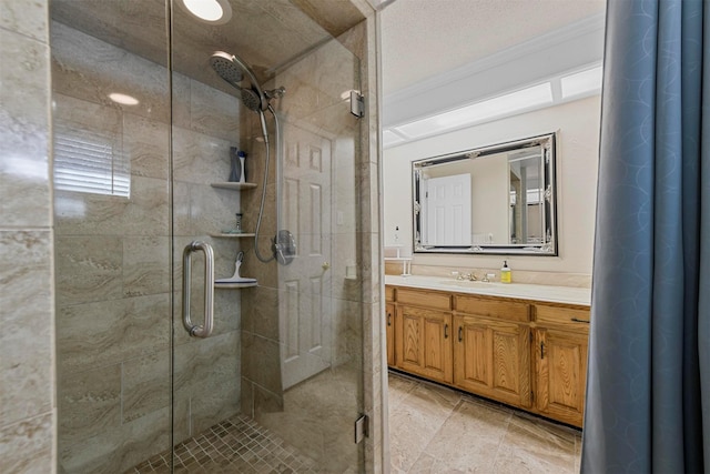 full bathroom with vanity and a stall shower