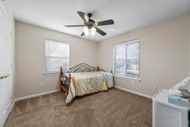 bedroom featuring ceiling fan, baseboards, and carpet floors