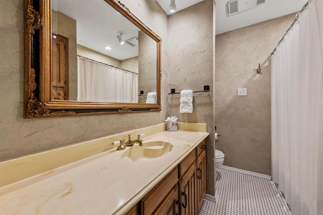 bathroom with tile patterned floors, visible vents, toilet, baseboards, and vanity