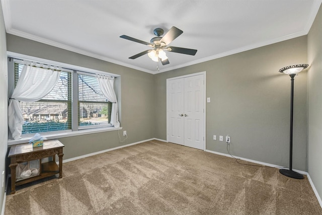 unfurnished bedroom with baseboards, carpet, and ornamental molding