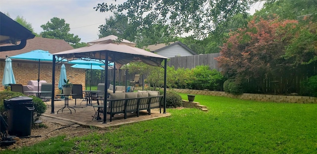 view of yard with a gazebo, a patio area, outdoor lounge area, and fence