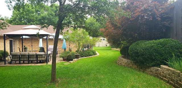 view of yard with a gazebo and an outdoor living space