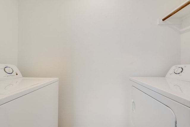 laundry room with washer and dryer and laundry area