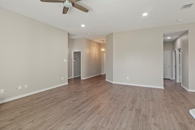 unfurnished room featuring light wood-type flooring, visible vents, a ceiling fan, recessed lighting, and baseboards