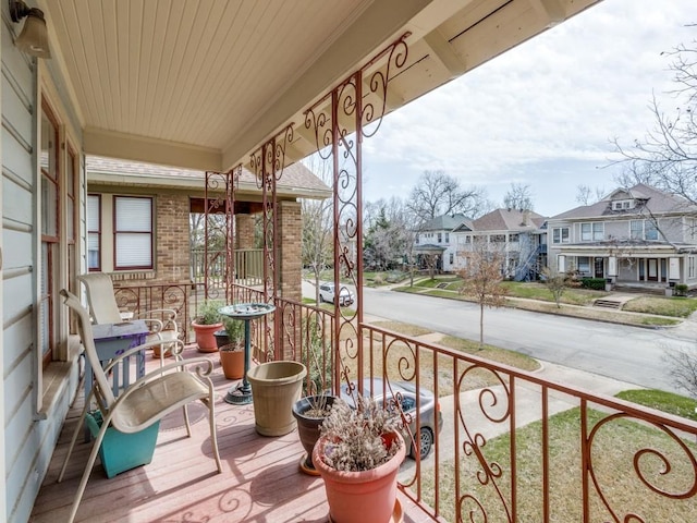 balcony featuring a residential view and covered porch