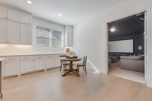 dining room with light wood-style flooring, recessed lighting, and baseboards